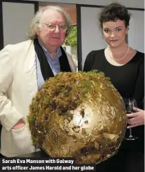  ??  ?? Sarah Eva Manson with Galway arts officer James Harold and her globe