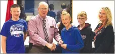  ?? Photo by Brenda Yates ?? Members of the Gravette Middle School Builders Club recently donated $5,000 to the Northwest Arkansas Children’s Hospital. Shown presenting the check to Malcom Winters, Kiwanis Club president, are Lane Wilkins (left), Winters, Lorelei Kellhofer (in...