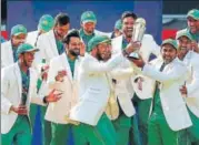  ?? AFP ?? Pakistan's Sarfraz Ahmed lifts the trophy as Pakistan players celebrate their win at the Oval.