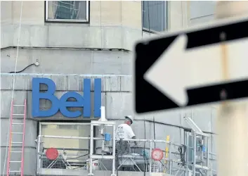  ?? SEAN KILPATRICK/CP FILES ?? A constructi­on worker works on a Bell building in Ottawa in this file photo. Telecom industry watchers say the real tell of the Liberal government’s as yet undefined telecome strategy will be whether it approves Bell’s proposed $3.9-billion takeover of...