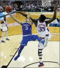  ?? AP/NATI HANRIK ?? Duke’s Grayson Allen (3) is fouled on his way to the basket by Kansas’ Udoka Azubuike (35) in the second half of the Jayhawks’ 85-81 overtime victory Sunday in the NCAA Midwest Regional Final. Allen finished with 12 points and four assists. Azubuike,...