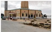  ?? TAREK SAMY / AP ?? People gather Saturday at the Al-Rawdah mosque in Egypt’s Sinai a day after attackers killed hundreds of worshipper­s there in the deadliest attack by Islamic extremists in the nation’s modern history.