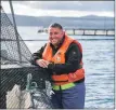  ?? ?? Scott Campbell is one of the team at Mowi’s salmon farm in Carradale.