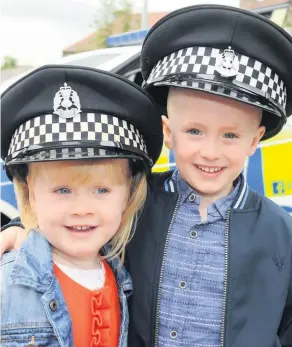  ??  ?? On patrol Siblings Rachel (2) and Daniel Collumb (4) 080918fair­hill_005