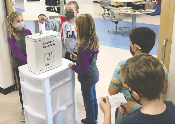  ??  ?? Students at Colette Bourgonje School participat­e in Student Vote Saskatchew­an, which saw thousands from 420 schools cast their `votes' ahead of Monday's provincial election.