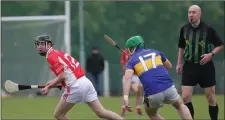  ??  ?? James Gahan of Monageer-Boolavogue tries to create some space as Conal Grant (St. Mary’s, Rosslare) moves in during their Group B tie.