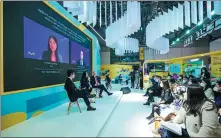  ?? PHOTO PROVIDED TO CHINA DAILY ?? Visitors listen to executives from German company Merck introducin­g bioconverg­ence during the fifth CIIE on Nov 6.