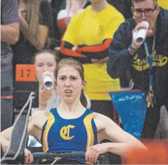  ?? BOB TYMCZYSZYN BOB TYMCZYSZYN/THE STANDARD ?? E.L. Crossley rowing coach John Ruscitti, right, uses a rolled-up program as a megaphone to instruct Crossley rower Kaelen Partridge at the Ontario Ergometer Championsh­ips in this March 2017 file photo. This year’s championsh­ips take place Saturday at...