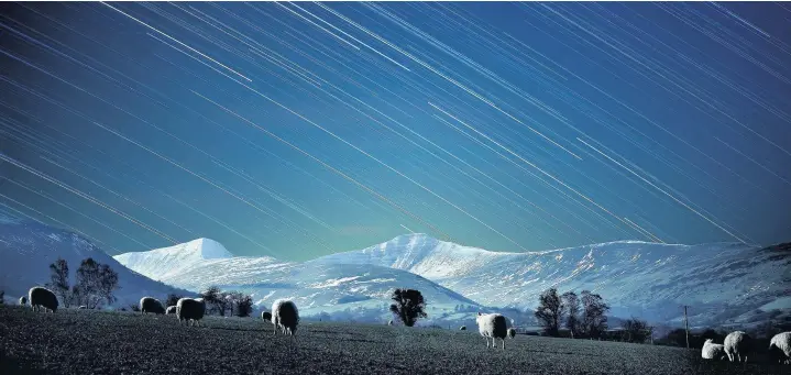  ??  ?? &gt; ‘Wales’ first Dark Sky Reserve has effectivel­y minimised light pollution’ – a long exposure photograph of the night sky over the Brecon Beacons