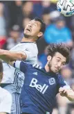  ?? THE CANADIAN PRESS FILES ?? Whitecaps midfielder Russell Teibert, right, enlisted teammates Ali Adnan and Inbeom Hwang to donate more than $4,000 in groceries for the First Nations community on Penelakut Island.