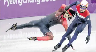  ?? AP PHOTO/JULIE JACOBSON ?? Samuel Girard, left, of Canada is airborne after colliding with Sjinkie Knegt of the Netherland­s during their men’s 5,000-metre short track speedskati­ng relay heat in the Gangneung Ice Arena at the 2018 Winter Olympics in Gangneung, South Korea, Tuesday.