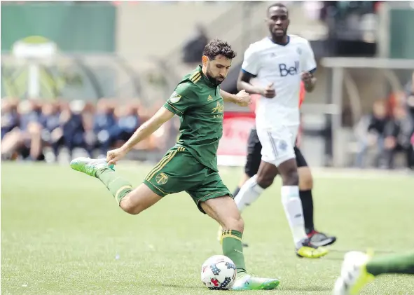  ?? — THE ASSOCIATED PRESS FILES ?? The Vancouver Whitecaps changed their lineup in an effort to shut down Portland Timbers playmaker Diego Valeri, but Valeri still set up Darren Mattocks with a sharp cross for what turned out to be the game-winning strike Saturday in Portland.