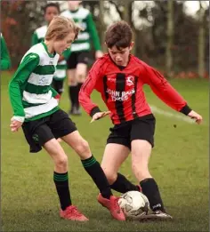  ??  ?? Filip Klempka of Gorey Celtic battling with TomFunge (Gorey Rangers).