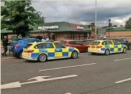  ??  ?? ●● Police outside Mcdonald’s after the incident