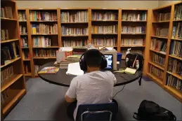  ?? JAE C. HONG — THE ASSOCIATED PRESS FILE ?? A Los Angeles Unified School District student attends an online class at the Boys & Girls Club of Hollywood in Los Angeles.