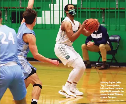  ?? ALLEN CUNNINGHAM/SUN-TIMES ?? Anthony Sayles (left), Troy D’Amico (below, left) and Louis Lesmond played with masks in the season opener Thursday against Prospect.