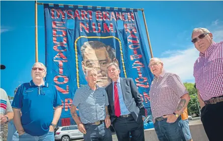  ?? Picture: Kenny Smith. ?? Two ex-miners from Fife, Tom Adams, left, and Bob Young, are met by Scottish Labour leader Richard Leonard along with dozens of former miners who gathered outside Holyrood to greet the new review.