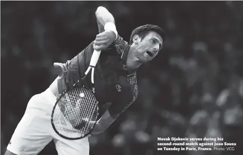  ?? Photo: VCG ?? Novak Djokovic serves during his second-round match against Joao Sousa on Tuesday in Paris, France.