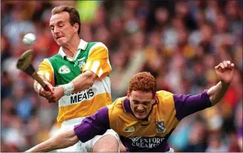  ??  ?? Nothing was ever spared when Offaly attacker Joe Dooley and Wexford defender Rod Guiney locked horns on a hurling field.