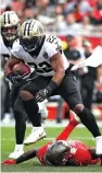  ?? Mark LoMogio/Associated Press ?? ■ New Orleans Saints running back Mark Ingram (22) leaps over Tampa Bay Buccaneers free safety Jordan Whitehead on Sunday in Tampa, Fla.