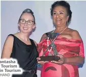  ?? Picture: REINAL CHAND ?? Fiji Hotel and Tourism Associatio­n CEO Fantasha Lockington, right, received the Dixon Seeto Tourism Leader Award during the ANZ Fiji Excellence in Tourism Awards in Denarau Nadi.