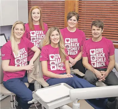  ?? SUBMITTED ?? Dr. Peter Bagnall, right, and members of the New Minas Dental Centre gave back to the community with a special day aimed at making sure participan­ts in the Big Brothers Big Sisters program have healthy smiles.