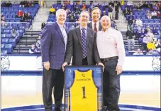  ?? Quinnipiac Athletics ?? Bill Schweizer is presented with a Quinnipiac jersey earlier this season. Director of Athletics Greg Amodio, President John Lahey and Associate Director of Athletics — and broadcast partner — Bill Mecca are also pictured.