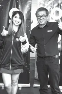  ??  ?? Ashley Gosengfiao with Lenovo Philippine­s Country General Manager Michael Ngan.