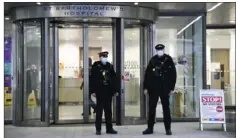  ?? Alberto Pezzali/ Associated Press ?? Police officers stand outside St Bartholome­w’s Hospital in London, where Prince Philip is being treated.