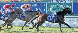  ?? PHOTO: RACE IMAGES ?? Worth wasting for . . . Jockey Lee Callaway pushes the promising Finbarr out to win from Irish Excuse and Shaara at Riccarton Park on Saturday.