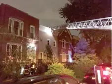  ??  ?? Firefighte­rs search a West Town apartment following a massive fire early Saturday.
| CHICAGO FIRE DEPARTMENT PHOTO