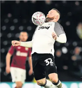  ?? Picture: Clive Mason/Getty ?? Derby’s Wayne Rooney brings the ball down on his chest during the FA Cup replay win against Northampto­n last week