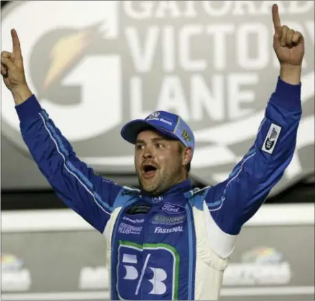  ?? JOHN RAOUX — THE ASSOCIATED PRESS FILE ?? Ricky Stenhouse Jr. celebrates in Victory Lane after winning a race at Daytona Internatio­nal Speedway.