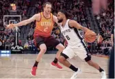  ?? ROB GRAY/USA TODAY SPORTS ?? Spurs guard Patty Mills (8) drives the ball during the second half defended by Jazz forward Joe Ingles.