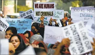  ?? Altaf Qadri Associated Press ?? STUDENTS PROTEST against a new citizenshi­p law in New Delhi in December 2019.