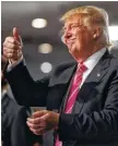  ??  ?? Republican presidenti­al candidate Donald Trump gives a thumbs-up during a church service earlier this month in Detroit.