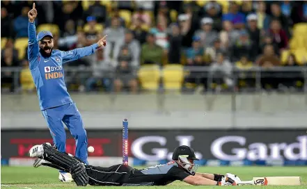  ?? GETTY IMAGES ?? India captain Virat Kohli appeals for a run out but Tim Seifert was safe on Friday night in Wellington.