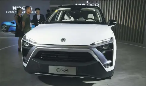  ?? WU CHANGQING / FOR CHINA DAILY ?? Chinese electric vehicle startup Nio’s ES8 SUV is displayed at a new energy tech show in Beijing.