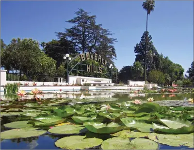  ?? BEVERLY HILLS CONFERENCE & VISITORS BUREAU ?? Stop and snap a selfie of the famous sign and water lilies at Beverly Gardens Park in Beverly Hills.