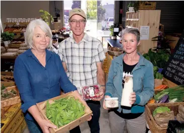  ??  ?? Baw Baw Food Hub manager Lynda Hoare with local suppliers Phil Rowe of Sunny Creek Organic and dairy processor Rachel Needoba of Butterfly Factory in Warragul.