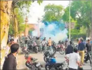  ?? HT PHOTO ?? Tear gas being fired at AMU students on Wednesday.