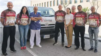  ??  ?? The Twilight shift van flanked by Paul Calleja (second from left), Alan Curry, Nestlé senior Category manager Charlene Ellul and LifeCyclis­ts