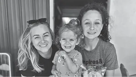  ?? PHOTOS PROVIDED BY KELLY BRENNAN ?? Kelly Brennan, left, her daughter Caroline and niece Elleigh Culver pose for a photo the day of the release of “Caroline’s Infusion Day.” Brennan wrote the book accompanie­d by Elleigh’s illustrati­ons.