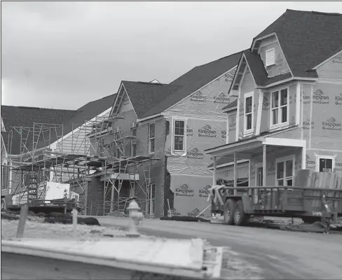  ?? The Associated Press ?? HOUSING MARKET: In this March 1 photo, new home constructi­on is underway in a housing plan in Zelienople, Pa. It’s lining up to be another strong year for investors who own homebuildi­ng stocks as a proxy bet on the health of the U.S. housing market....