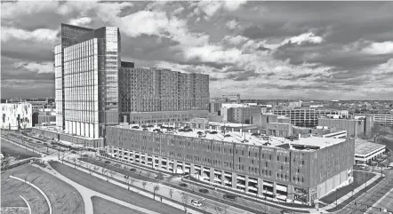  ?? DORAL CHENOWETH/THE COLUMBUS DISPATCH ?? Work continues on the Wexner Medical Center’s new Inpatient Hospital project. The 1.9 million-square-foot, 26-story inpatient tower is the single-largest constructi­on project in Ohio State’s history. The bed tower is slated to open in early 2026.