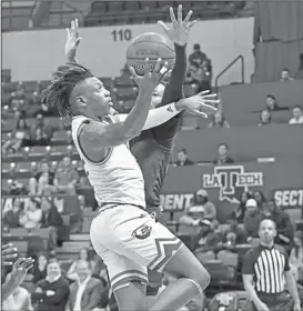  ?? Tom Morris/Louisiana Tech Sports Informatio­n ?? To the rim: Louisiana Tech’s Amorie Archibald goes up for a shot during a game against Florida Internatio­nal earlier this season in Ruston, La. The Bulldogs will finish the regular season today at home against Charlotte.