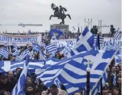  ??  ?? wave flags and banners during a rally against the use of the term ‘Macedonia’ in any solution to the name dispute between Athens and Skopje in Thessaloni­ki, on Sunday.