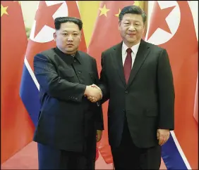  ?? KOREAN CENTRAL NEWS AGENCY/KOREA NEWS SERVICE VIA AP ?? North Korean leader Kim Jong Un, left, and Chinese counterpar­t Xi Jinping, shake hands at the Great Hall of the People in Beijing.