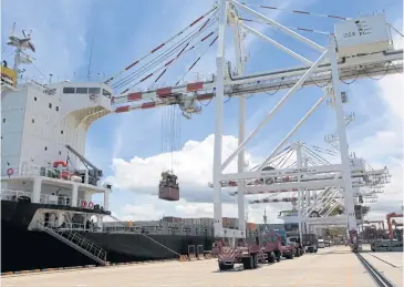  ?? APICHART JINAKUL ?? Cranes work at Laem Chabang port in Chon Buri, one of three provinces in the EEC developmen­t project.