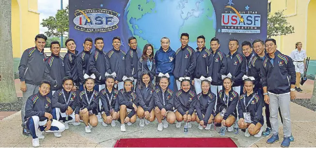  ??  ?? National University’s back-to-back UAAP cheer title squad bags the bronze in the co-ed elite division of the Internatio­nal Cheer Union World Championsh­ips in Orlando recently.